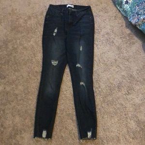 Dark ripped blue jeans
